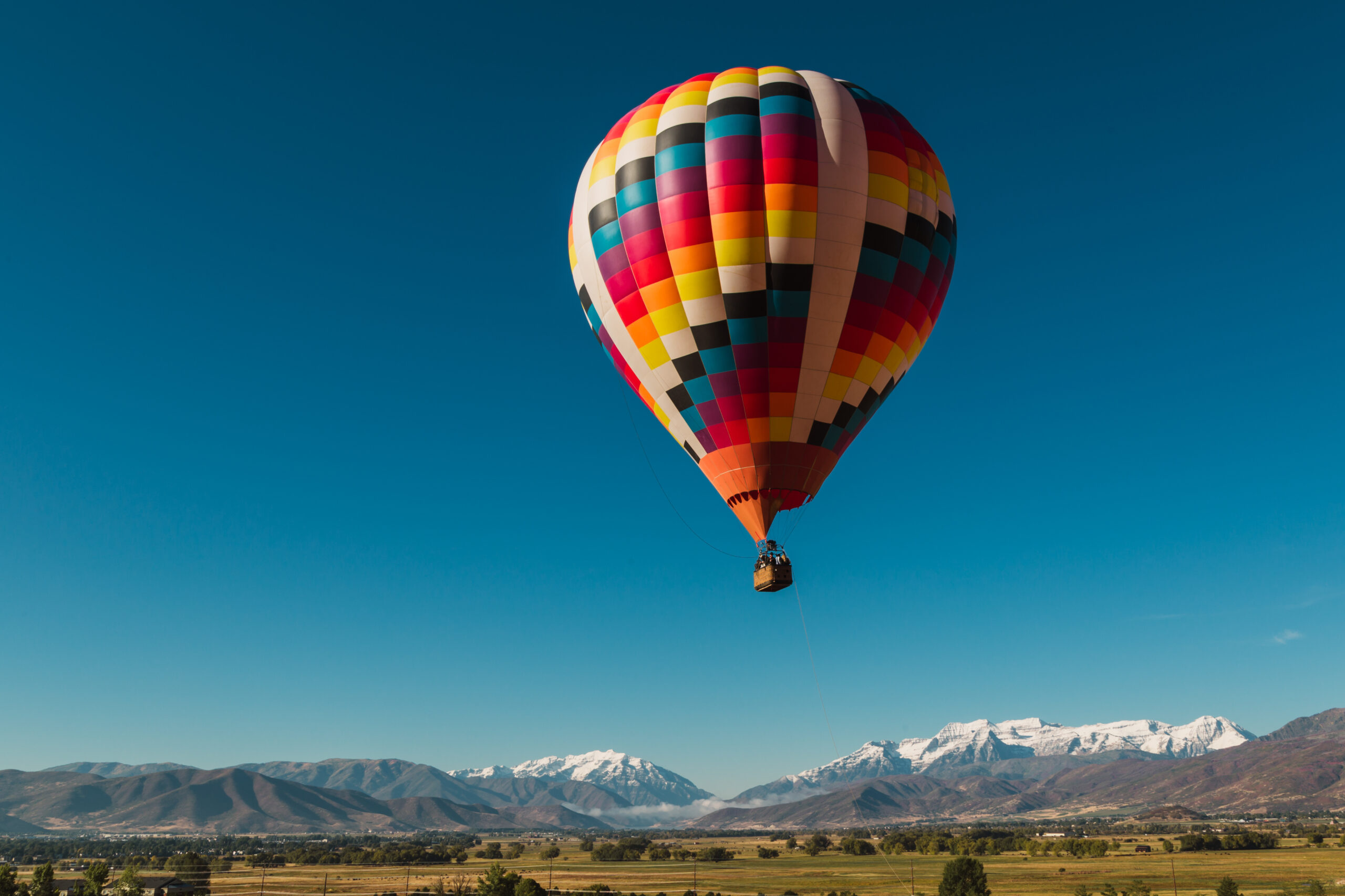 Hot air ballooning in the snow-capped mountains