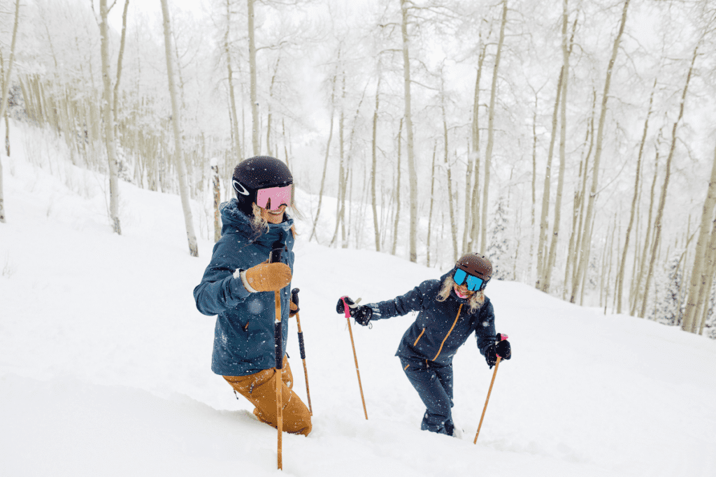 Skiers in deep powder Aspen