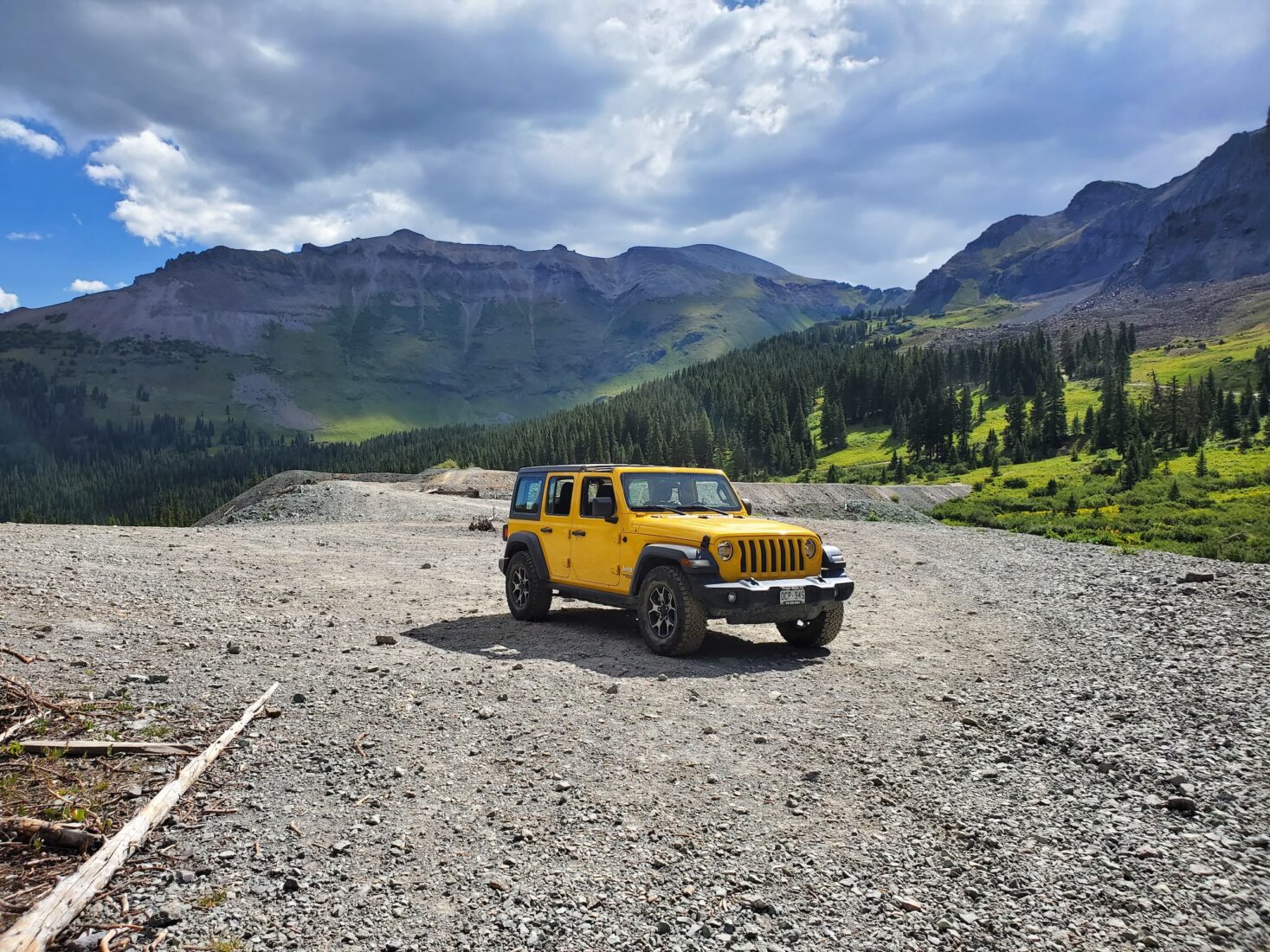 Yellow Jeep in Summer with Mountain Background
