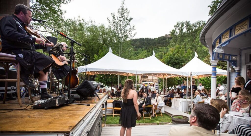 A wedding celebration at an Aspen Estate with a Mountain background