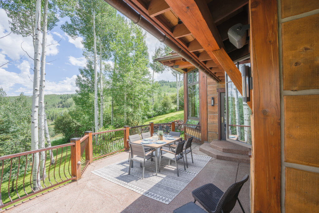 Multi-generational family enjoying outdoor terrace at Aspen luxury rental