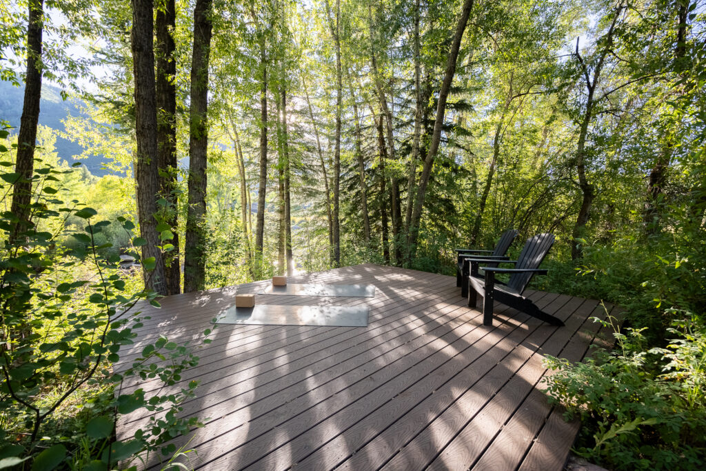 Private yoga session overlooking the Aspen mountains from a luxury rental