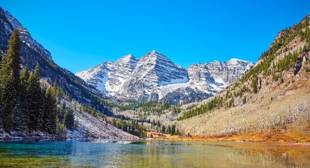 A serene landscape view of Maroon Bells, Colorado during Summer in Colorado.