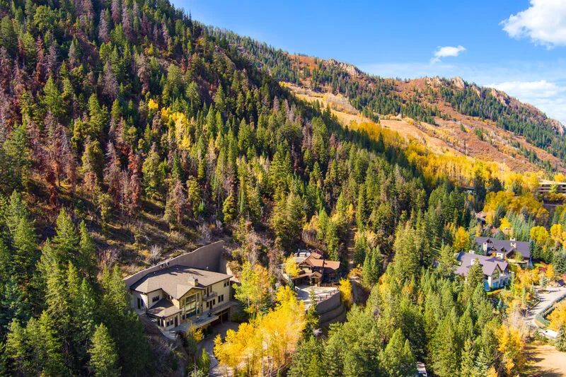 Aerial View of Ute Avenue home, nestled on the north-facing slopes of Ajax Mountain in Autumn