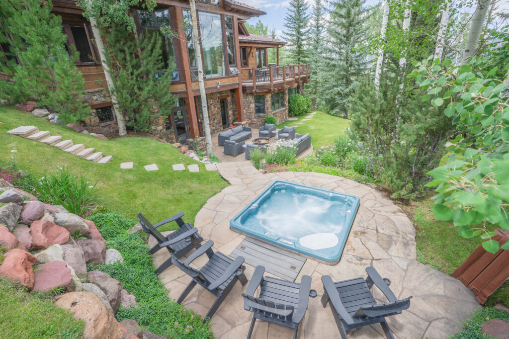 Luxury Aspen vacation rental large family hot tub and outdoor entertaining pavilion.