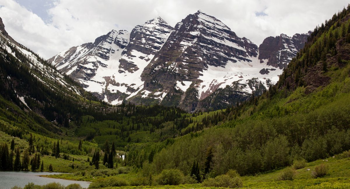 Summer view of the Maroon Bells from the Highlands base area trail system